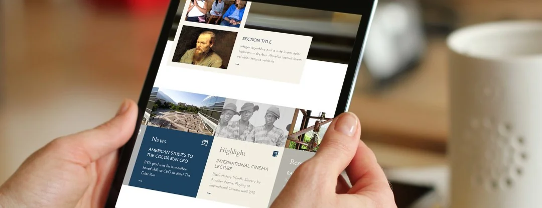 BYU Humanities website mockup on a tablet, showing image-led news and research cards.