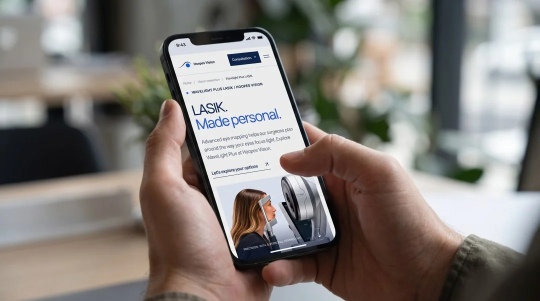 Phone mockup showing the Hoopes Vision WaveLight Plus LASIK page with its headline, introduction, and consultation navigation.